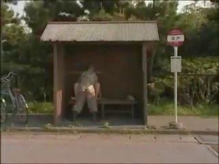 Japanese lovers at bus stop